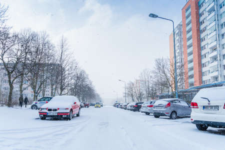Rostock, Germany - april 24, 2018: snow covered car drives in winter stormのeditorial素材