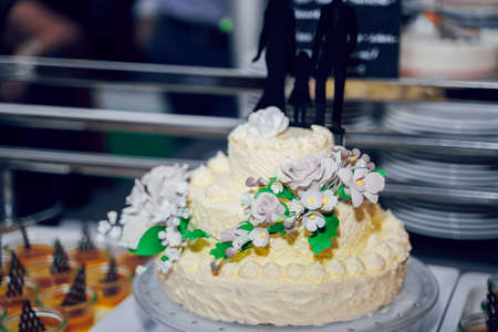 white Wedding cake with roses. ceremony catering.の写真素材