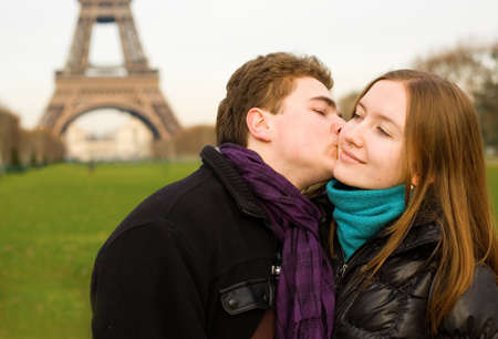 Romantic loving couple in Paris kissing near the Eiffel Towerの写真素材