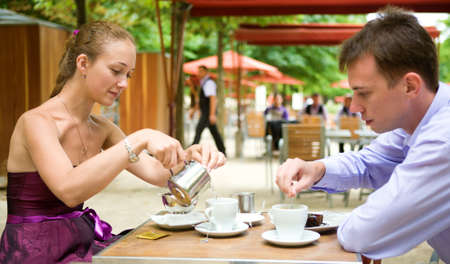 Romantic couple in Paris, having breakfast in a Parisian street cafeの写真素材