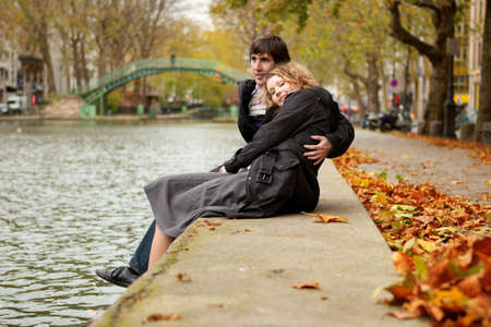 Dating couple in Paris on canal Saint-Martinの写真素材
