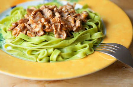 Pasta with basilic and chanterellesの写真素材