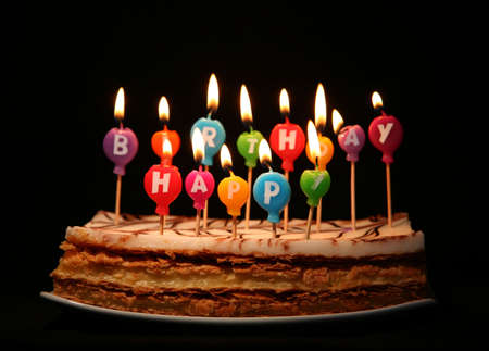 Happy birthday candles on a cakeの写真素材