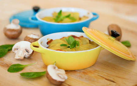 Delicious potato gratin in colorful ramekinsの写真素材