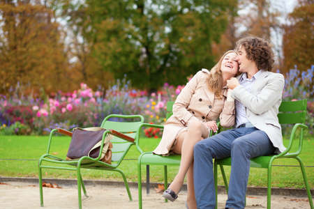Romantic couple in a park, having a dateの写真素材