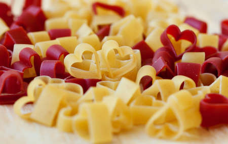 Red and yellow heart-shaped pastaの写真素材