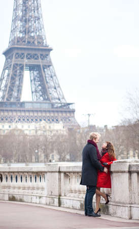 Romantic couple in love dating near the Eiffel Tower in Parisの写真素材