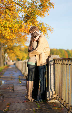 Couple in love tenderly hugging on the Fontanka embankment in Saint-Petersburg, Russiaの写真素材