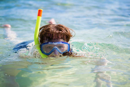 Woman snorkeling in turquoise tropical watersの写真素材