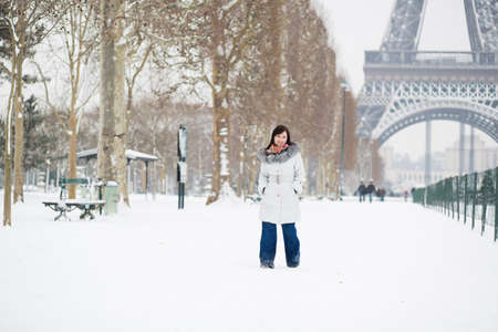 Beautiful girl walking by Champ de Mars at winter dayの写真素材