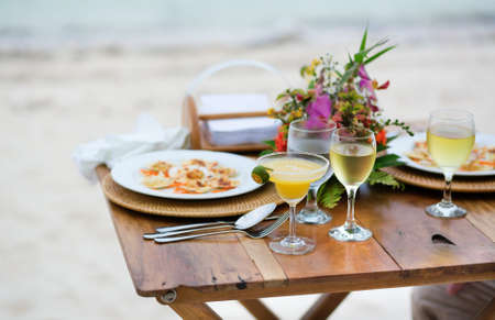 Romantic dinner served for two on a beachの写真素材