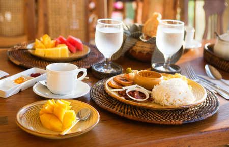 Traditional Philippino breakfast with garlic rice and adoboの写真素材