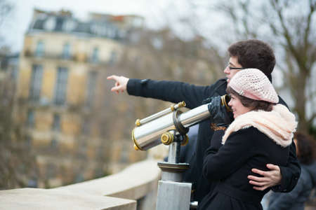 Tourists using telescope for sightseeingの写真素材