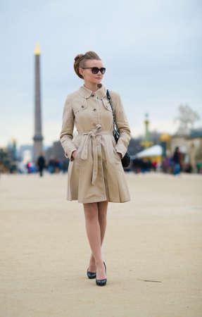 Beautiful young Parisian woman with Egyptian obeliskの写真素材