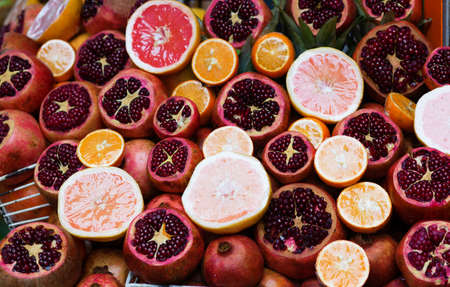 Cut pomegranates and grapefruits on a Turkish marketの写真素材