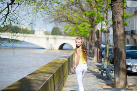 Girl near the Seine on a summer dayの写真素材