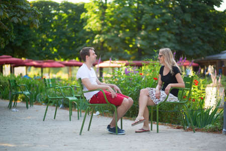 Couple relaxing in the Tuileries garden of Parisの写真素材