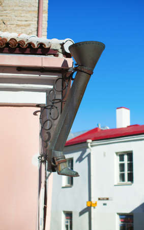 Decorative boot-shaped drainpipe in Tallinn, Estonia