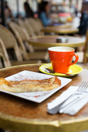 Coffee and pancake in a Parisian street cafeの写真素材