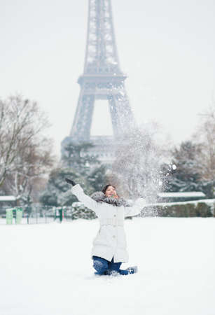 Happy young girl having fun on a winter day in Parisの写真素材