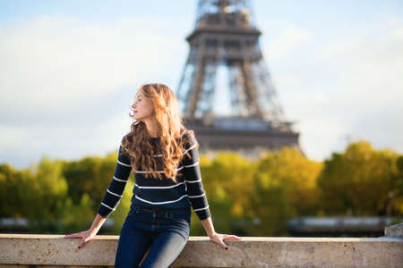 Beautiful young woman in Paris on a fall dayの写真素材