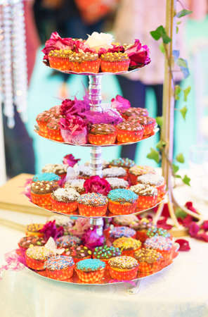 Cupcakes decorated with icing and flowersの写真素材