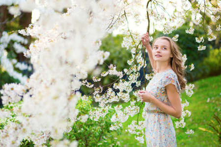 Beautiful girl in spring gardenの写真素材