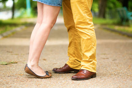 Male and female legs during a date.の写真素材