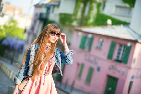 Beautiful girl in pink dress on Montmartre.の写真素材