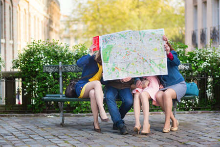 Tourists looking for direction in Paris.の写真素材