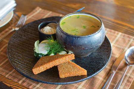 Traditional Russian fish soup (ukha) served in casseroleの写真素材