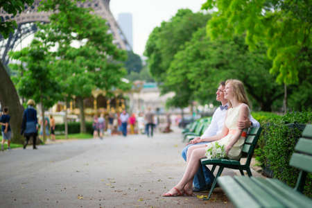 Just married couple near the Eiffel tower in Parisの写真素材