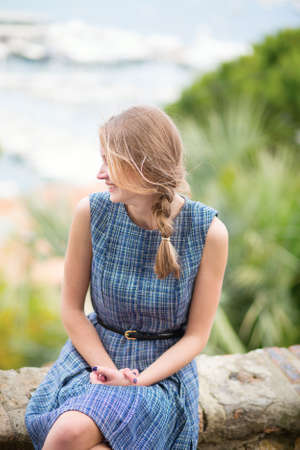 Young girl looking at the city of Cannes from Le Suquet hillの写真素材