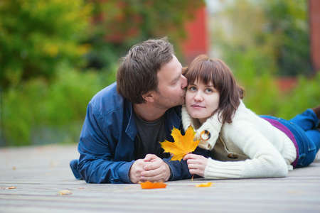 Romantic couple enjoying beautiful fall day togetherの写真素材