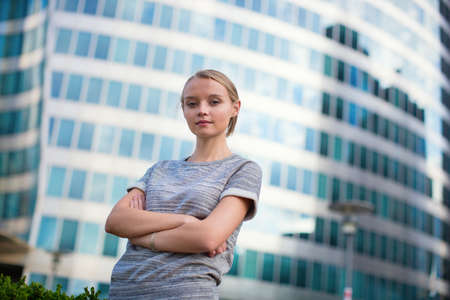 Young beautiful confident woman in business district of Parisの写真素材