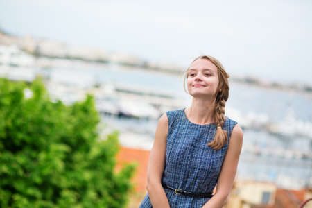 Young beautiful woman on Le Suquet hill in Cannes, Franceの写真素材