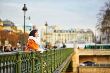 Happy young tourist in Paris on a winter or spring dayの写真素材