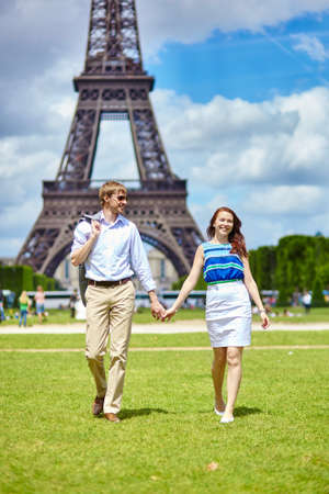 Romantic dating couple walking in Paris near the Eiffel towerの写真素材