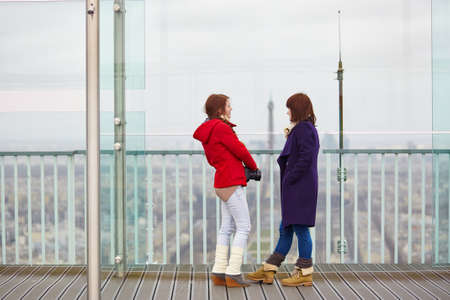 Two girls on the observation platform of the Montparnasse towerの写真素材