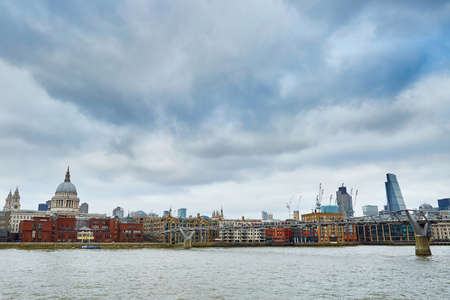 London skyline with St. Paul's cathedral, river Thames and the only pedestrian bridge in London â Millennium bridgeの写真素材
