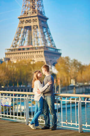 Beautiful romantic couple in Paris near the Eiffel towerの写真素材