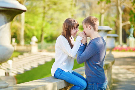 Young romantic couple in Paris, having a date in the Luxembourg gardens