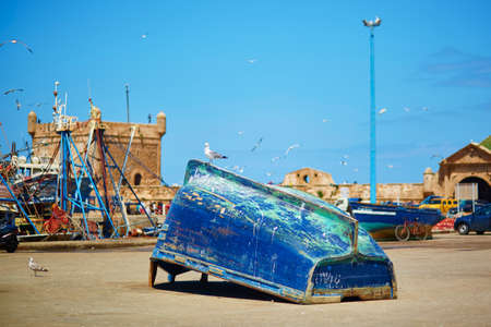 Traditional blue fishing boat in the port of Essaouira, Moroccoの写真素材