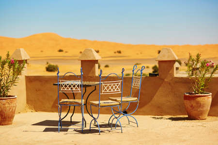 Table of a cafe in Merzouga village in Sahara desert, Moroccoの写真素材