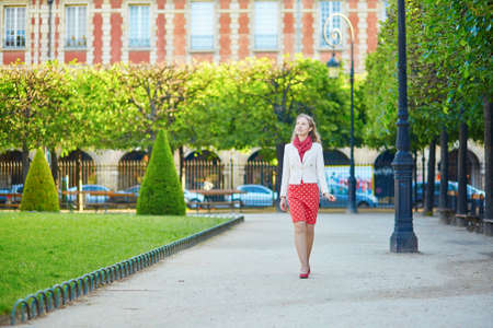 Beautiful young woman in Paris, walking in Marais districtの写真素材