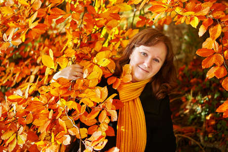 Cheerful young girl enjoying beautiful autumn day