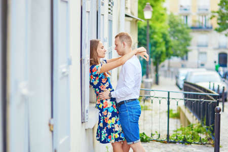 Young romantic couple having a date on a street of Montmartre in Paris, Franceの写真素材