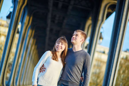Young romantic couple in Paris on the Bir Hakeim bridgeの写真素材