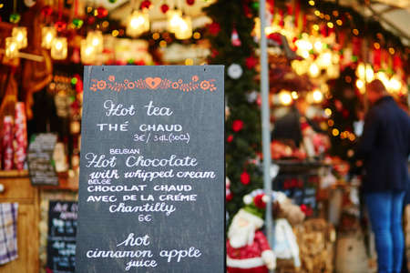 Menu with list of Christmas treats on Parisian Christmas marketの写真素材