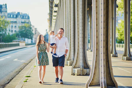 Happy family of three enjoying their vacation in Paris, Franceの写真素材